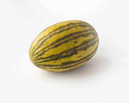 Striped yellow with green stripes oblong melon on a white background.の写真素材