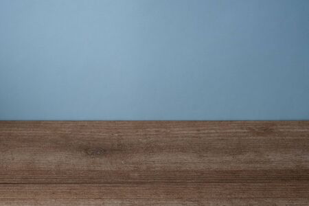 Empty wood boards over dark blue wallpaper backgroundの写真素材