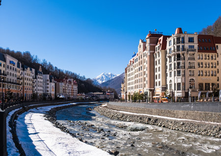 Sochi, Russia - March 4, 2020: Ski resort Rosa Khutor. A view of the street and the Mzymta River....