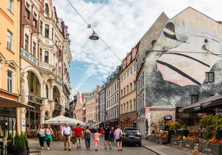 Riga, Latvia - July 12, 2018: Cityscape. Tourists walk along the beautiful Tirgonyu street in the historic district of Old Townのeditorial素材