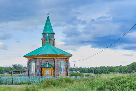 Tyumen, Russia - June 22, 2020: Local wooden from pine logs mosque in the Siberian village Novoufimskaya on a summer dayのeditorial素材