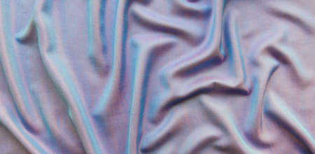 The texture of the draped fabric is blue with a shimmer in pink as a background. Color gradient bannerの写真素材