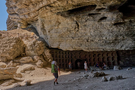 Sudak, Russia September 14, 2020 Black Sea coast Crimean peninsula People resting in grotto Golitsyn carved out of Koba-Kaya mountain by waves Scenic natural attraction in botanical reserve New Worldのeditorial素材
