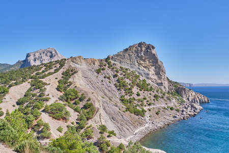 Mountain landscape, Crimean peninsula. People walk along the tourist route Golitsyn Trail. Botanical reserve New World. Bannerの写真素材