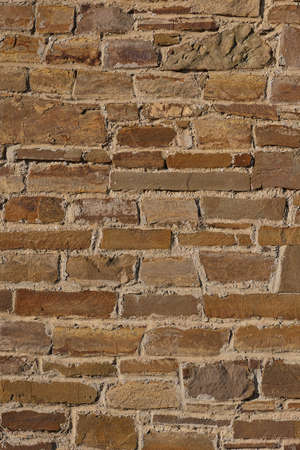 Texture of a stone brown wall of an ancient fortressの写真素材