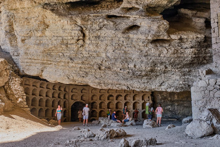 Sudak, Russia September 14, 2020 Black Sea coast Crimean peninsula People resting in grotto Golitsyn carved out of Koba-Kaya mountain by waves Scenic natural attraction in botanical reserve New Worldのeditorial素材