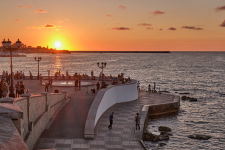 Sevastopol, Russia - September 27, 2020: People are walking along the seaside promenade at sunset.のeditorial素材