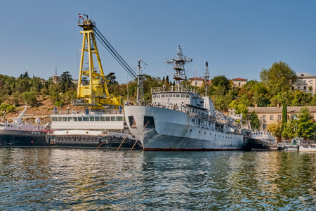 Sevastopol, Russia - September 26, 2020: Self-propelled floating crane SPK-54150 and demagnetization vessel SR-137 at the pier of the South Bay of Sevastopol. Black Sea Fleet of Russia.のeditorial素材