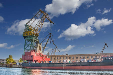 Crane on the background of old buildings of the Sevastopol Marine Plant named after Sergo Ordzhonikidzeの写真素材