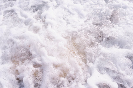 Sea white foam texture as abstract backgroundの写真素材