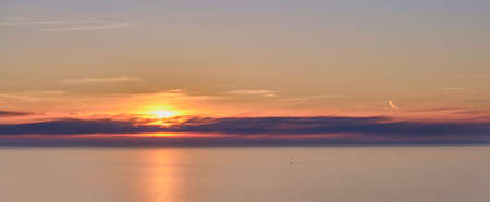 Colorful sunset at sea. Beautiful cloudscapeの写真素材