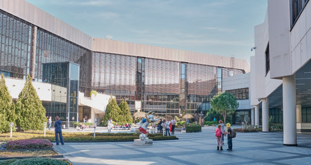 The courtyard of the airport of the city of Sochi. Passengers await their flight in the open air among the plants near the fountain.のeditorial素材
