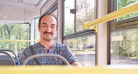 Portrait of senior Asian man in tram.の写真素材