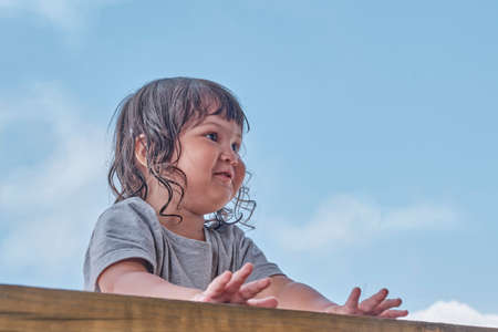 Close up portrait of smiling little Asian girl with black hairの写真素材