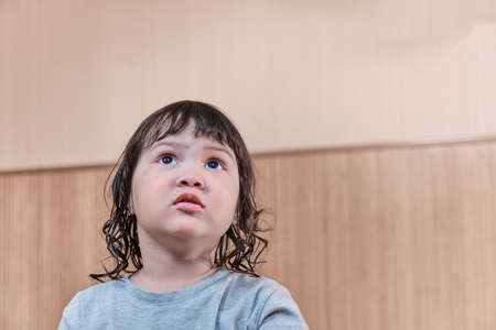Close-up home portrait of little asian girlの写真素材