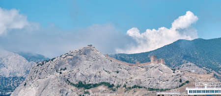 Ancient Sudak fortress, Crimea. View of mountains, walls and towers.の写真素材