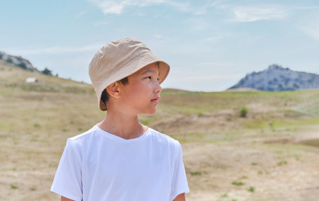 Portrait of an Asian boy in a white T-shirtの写真素材