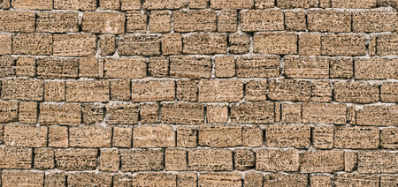 Wall from a handmade brick from shell rockの写真素材