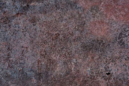 Texture of rusty iron sheet with two little holes as an abstract background.の写真素材