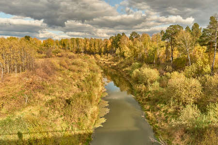 Siberian autumn landscape with taiga river.の写真素材