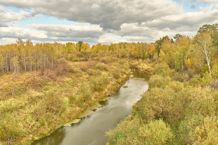 Siberian autumn landscape with taiga river.の写真素材