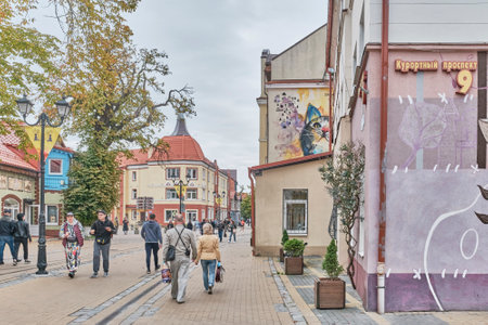 People walking along avenue Kurortny in autumn, Zelenogradsk, Russiaのeditorial素材