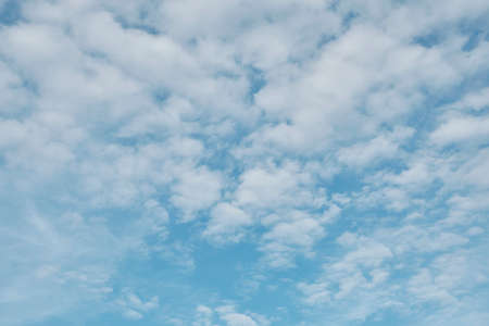 Beautiful blue sky with fluffy cloudsの写真素材