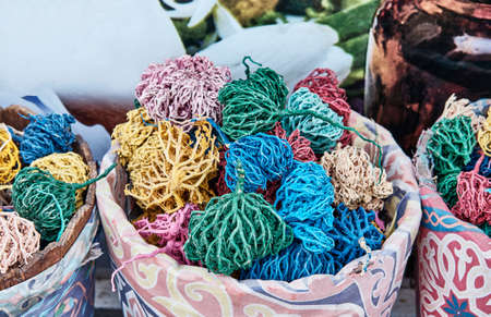 Dried, painted colorful plants of Jericho rose, heart of desert as souvenir for tourists in Egyptの写真素材