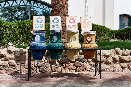 Multi colored clay jugs with ornaments as garbage bins for sorting waste in Egypt. Zero waste conceptの写真素材