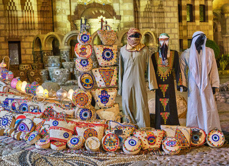 Egyptian souvenirs for tourists in square near mosque Bags,colorful lamps, mannequins in dressのeditorial素材