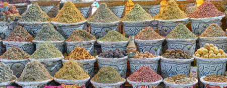 Herbal, berry dry mixes for making tea, oriental spices in baskets at night street market.の写真素材