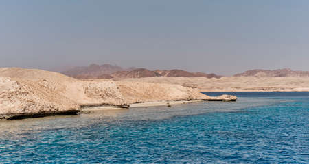 Beautiful seascape with a hilly coastline as a natural backdrop. Nature concept.の写真素材
