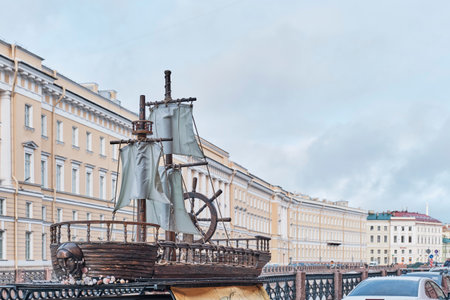 Model of antique wooden sailing ship over background of buildings on street of St.Petersburg,Russiaのeditorial素材