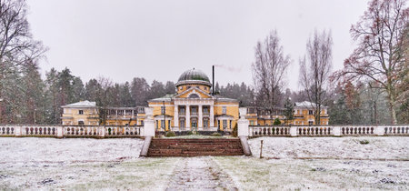 Country seat in style of classicism, 19th century. Late autumn landscape with first snowfall.のeditorial素材