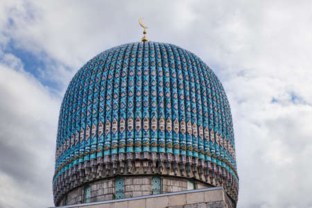 Dome of St. Petersburg Cathedral Mosque with crescent moon,decorated with blue majolica.の写真素材