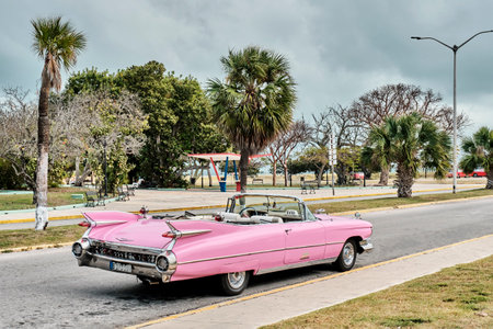 Pink retro cabriolet car taxi on street of resort town Varadero, Cuba.のeditorial素材
