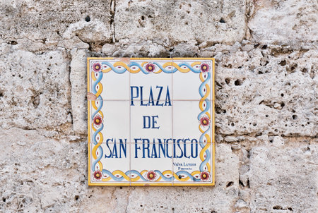 Colorful plaque with name of city square in Spanish. In English: San Francisco Square. Havana, Cubaのeditorial素材