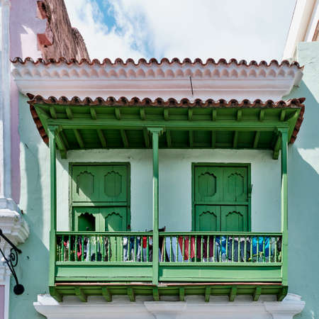 Typical wooden balcony of colonial Spanish style residential house in historic center of Havana,Cubaの写真素材