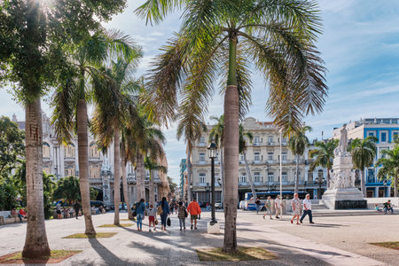 City-center park with palm trees, paths and benches surrounding statue of Jose Marti, Havana, Cubaのeditorial素材