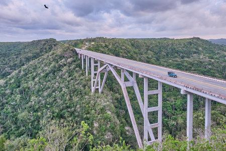 The highest of Cuba Bacunayagua Bridge. Car moving along bridge.の写真素材