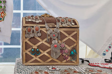 Old vintage chest for traditional Tatar jewelry. National necklace and earrings.の写真素材