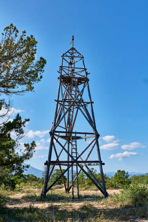 Old observation wooden fire tower on coast of Barguzinsky Bay of Lake Baikal, Russia.の写真素材