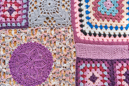 Colourful patchwork abstract background. Different pieces, knitted and crocheted are into one canvas