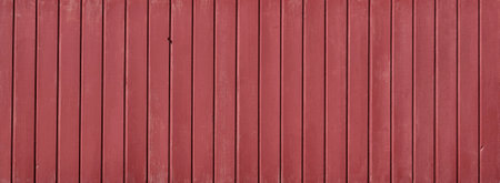 Red painted wooden fence or wallの写真素材