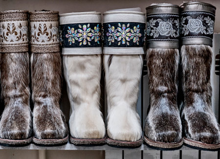 Fur boots made of natural deerskin decorated with floral embroidery with threads or stones.の写真素材