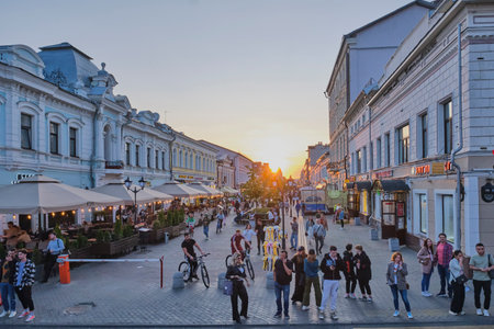 People walking at sunset along tourist pedestrian Bauman street, Kazan, Russiaのeditorial素材