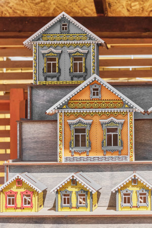Kazan, Russia - June 8, 2023: Colorful rural little houses made of plywood, souvenirs for tourists. Windows, carved architraves, Tatar ornament. travel conceptのeditorial素材