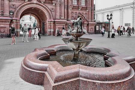 Kazan, Russia - June 7, 2023: Metal and real pigeons drinking water from fountain bowls. Fountain with sculpture composition Pigeons on pedestrian tourist street Bauman. Sculptor IN Bashmakov, 2000のeditorial素材
