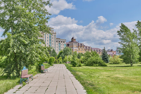 Kazan, Russia - June 8,2023: Alley with benches in the Millennium Park. Summer cityscape.のeditorial素材