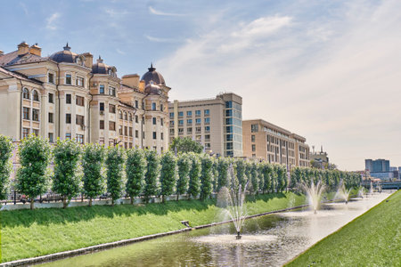 View of the Bulak Canal, fountains and buildings on Levo-Bulachnaya Street. Water landscape. Summer cityscape, Kazan, Tatarstan, Russia.の写真素材